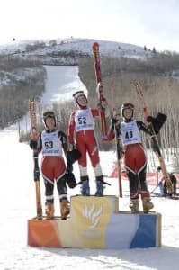Three skiers on the podium
