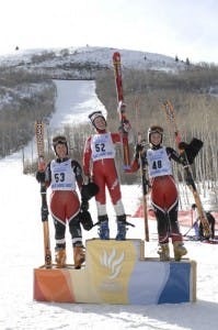 Three skiers on the podium